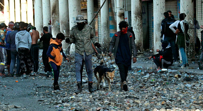Anti-government protesters gather during clashes with security forces in Baghdad, Iraq, Saturday, Nov. 30, 2019. Anti-government protesters gather during clashes with security forces in Baghdad, Iraq, Saturday, Nov. 30, 2019.