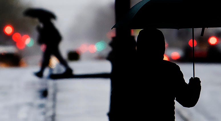 Pedestrians shield from the rain with an umbrellas during a cold rainy day in Center City, Sunday, Dec. 1, 2019 in Philadelphia. Pedestrians shield from the rain with an umbrellas during a cold rainy day in Center City, Sunday, Dec. 1, 2019 in Philadelphia.