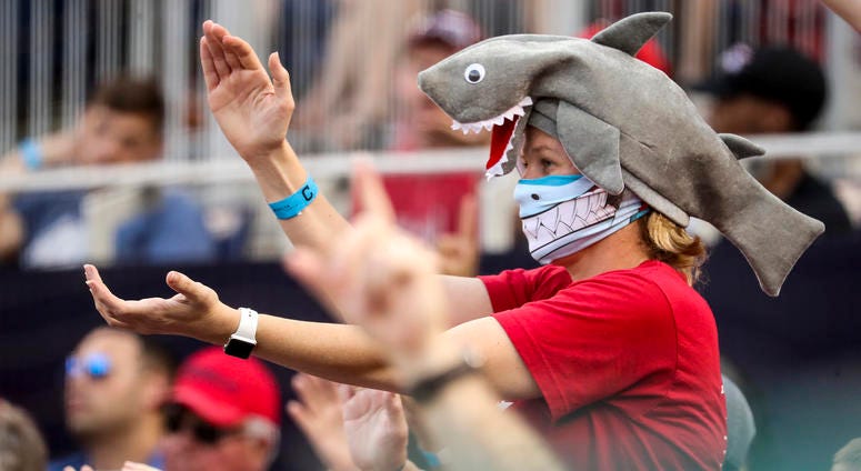 A fan wears a shark hat as Washington Nationals' Gerardo Parra comes up to bat in the eighth inning of a baseball game against the Cleveland Indians at Nationals Park in Washington on Sept. 29, 2019. A fan wears a shark hat as Washington Nationals' Gerardo Parra comes up to bat in the eighth inning of a baseball game against the Cleveland Indians at Nationals Park in Washington on Sept. 29, 2019.