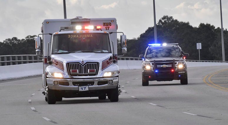Police cars escort an ambulance after a shooter open fire inside the Pensacola Air Base, Friday, Dec. 6, 2019 in Pensacola, Fla. Police cars escort an ambulance after a shooter open fire inside the Pensacola Air Base, Friday, Dec. 6, 2019 in Pensacola, Fla.