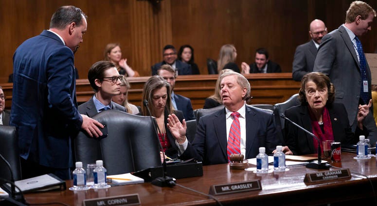 Senate Judiciary Committee Chairman Lindsey Graham, R-S.C., right, speaks with Sen. Mike Lee, R-Utah, a member of the panel. Senate Judiciary Committee Chairman Lindsey Graham, R-S.C., right, speaks with Sen. Mike Lee, R-Utah, a member of the panel.