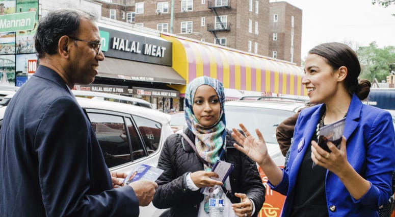 Alexandria Ocasio-Cortez, right, during a Bengali community outreach in New York. Alexandria Ocasio-Cortez, right, during a Bengali community outreach in New York.