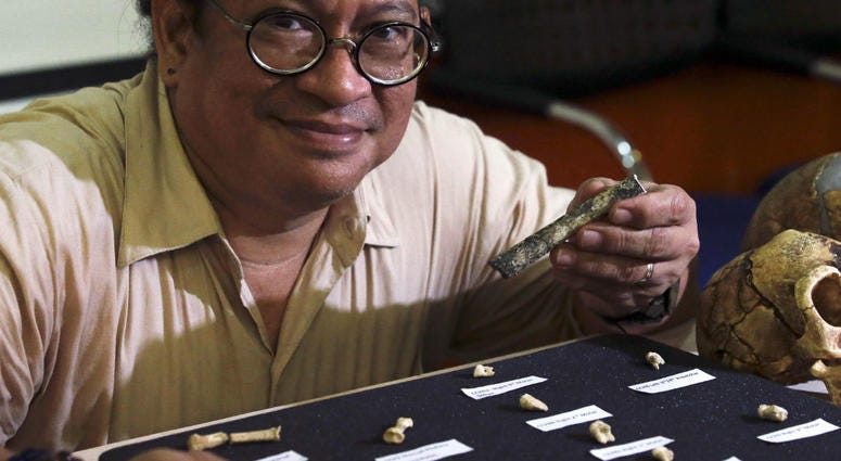 Filipino archeologist Armand Salvador Mijares shows bones and teeth they recovered from Callao Cave belonging to a new specie they called Homo luzonensis during a press conference in metropolitan Manila, Philippines on Thursday, April 11, 2019. Filipino archeologist Armand Salvador Mijares shows bones and teeth they recovered from Callao Cave belonging to a new specie they called Homo luzonensis during a press conference in metropolitan Manila, Philippines on Thursday, April 11, 2019.