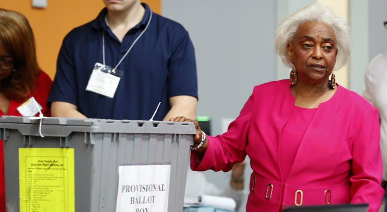 Broward County Supervisor of Elections Brenda Snipes, right, shows a ballot box that was found in a rental car after the elections and turned out to only contain election day supplies, as election employees sort ballots and prepare to count them. Broward County Supervisor of Elections Brenda Snipes, right, shows a ballot box that was found in a rental car after the elections and turned out to only contain election day supplies, as election employees sort ballots and prepare to count them.