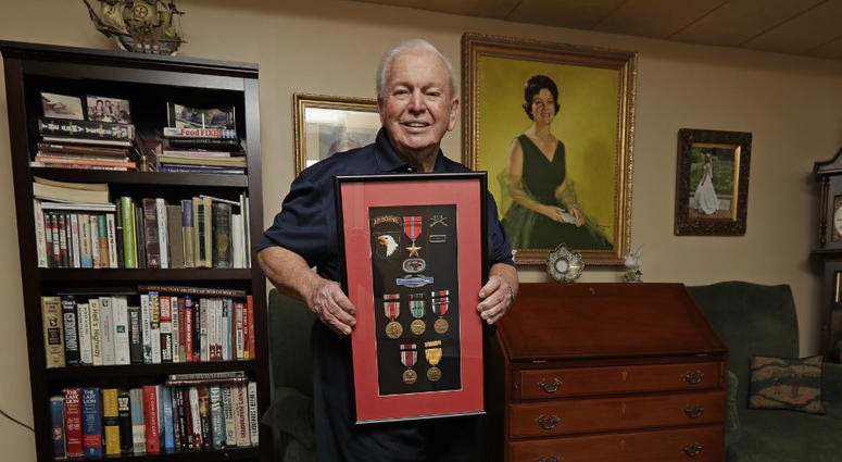 In this Wednesday, May 22, 2019, photo, D-Day veteran Eugene Deibler poses for a photo with his medals from WWII at his home in Charlotte, N.C. In this Wednesday, May 22, 2019, photo, D-Day veteran Eugene Deibler poses for a photo with his medals from WWII at his home in Charlotte, N.C.