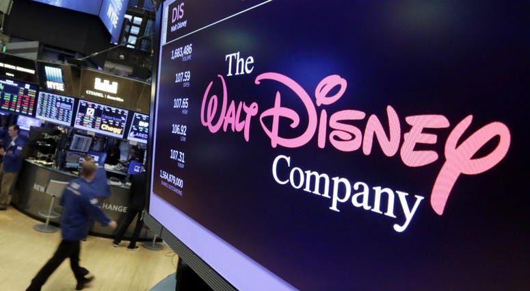 In this Aug. 8, 2017, file photo, The Walt Disney Co. logo appears on a screen above the floor of the New York Stock Exchange. In this Aug. 8, 2017, file photo, The Walt Disney Co. logo appears on a screen above the floor of the New York Stock Exchange.