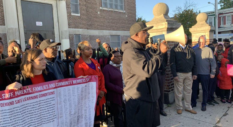 Activist Antoine Little leads a rally this morning outside T.M. Pierce Elementary School. Activist Antoine Little leads a rally this morning outside T.M. Pierce Elementary School.