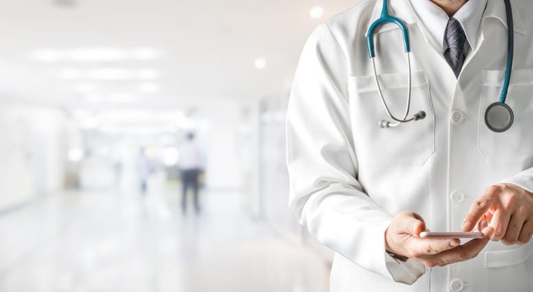 A doctor in the hallway. A doctor in the hallway.