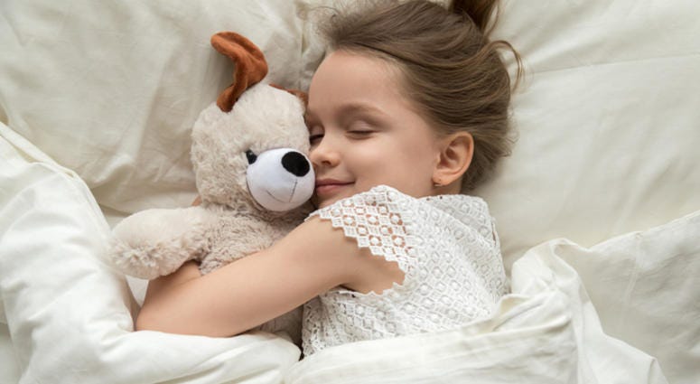A young girl sleeping. A young girl sleeping.