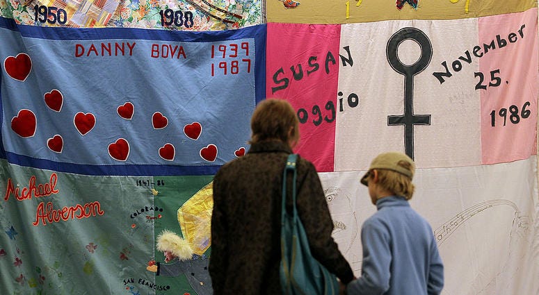 Visitors look at panels of the AIDS Memorial Quilt that are being displayed on February 13, 2012 in San Francisco, California. Visitors look at panels of the AIDS Memorial Quilt that are being displayed on February 13, 2012 in San Francisco, California.