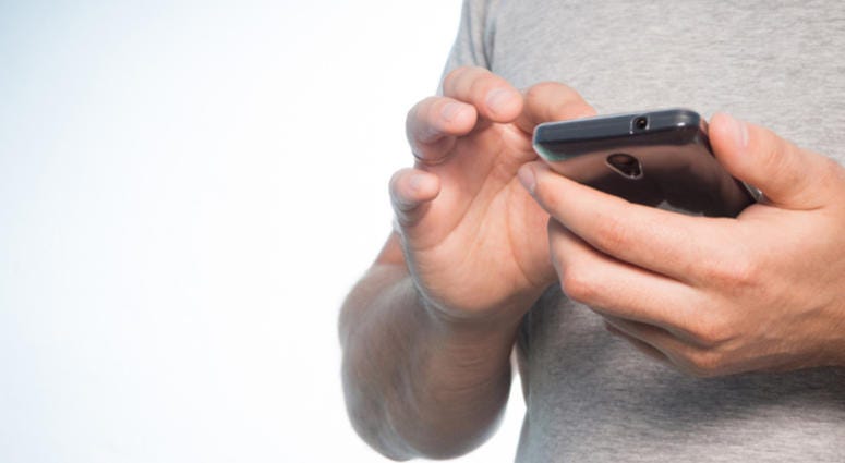 Man using his phone. Man using his phone.