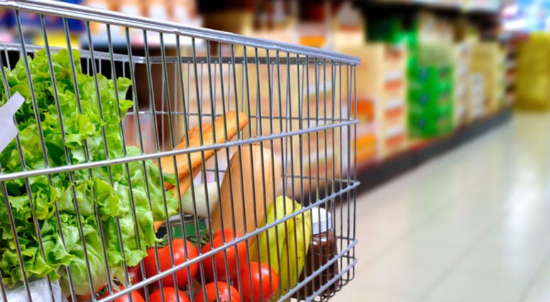 A grocery cart. A grocery cart full of food.