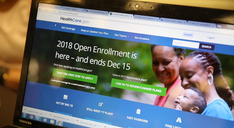 A computer screen shows the enrollment page for the Affordable Care Act. Obamacare