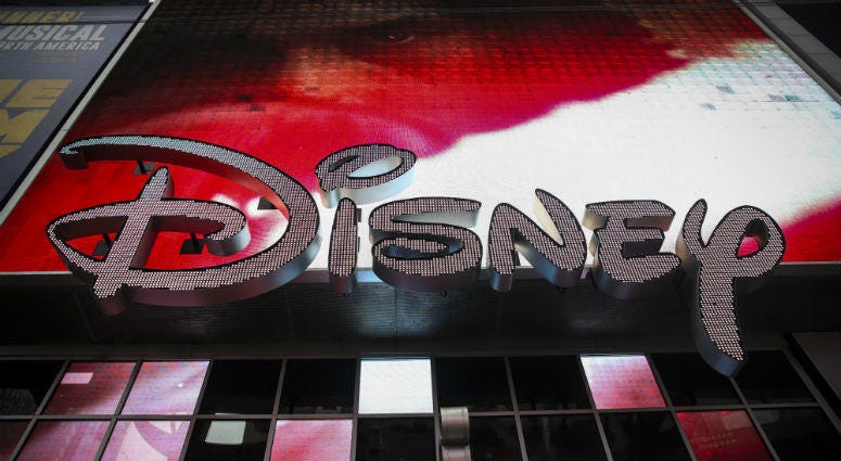 The Disney logo is displayed outside the Disney Store in Times Square, December 14, 2017 in New York City. Disney