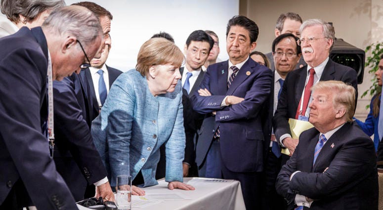 German Chancellor Angela Merkel deliberates with U.S. President Donald Trump on the sidelines of the official agenda on the second day of the G-7 summit. G-7 summit