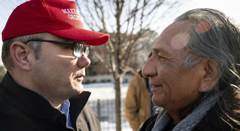 Guy Jones, left, and a supporter of President Donald Trump named Don embrace during a gathering of Native American supporters in front of the Catholic Diocese of Covington in Covington, Ky., Tuesday, Jan. 22, 2019. Guy Jones, left, and a supporter of President Donald Trump named Don embrace during a gathering of Native American supporters in front of the Catholic Diocese of Covington in Covington, Ky., Tuesday, Jan. 22, 2019.