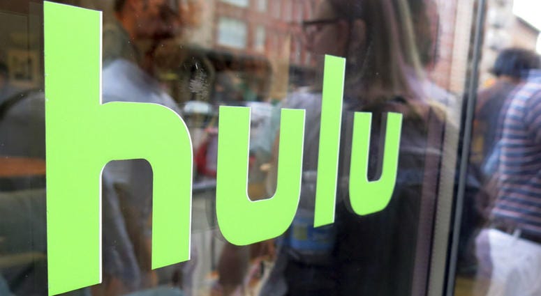 This June 27, 2015, file photo, shows the Hulu logo on a window at the Milk Studios space in New York. Disney has struck a deal with Comcast that gives it full control of streaming service Hulu. This June 27, 2015, file photo, shows the Hulu logo on a window at the Milk Studios space in New York. Disney has struck a deal with Comcast that gives it full control of streaming service Hulu.
