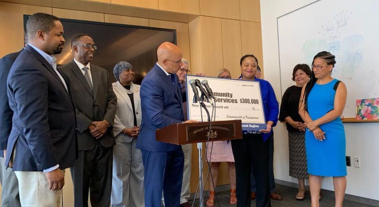 State legislators presented a giant check to CLS attorney Dawn Williams Aug. 8, 2019, representing the $300,000 in additional funds for its senior housing program. Community Legal Services