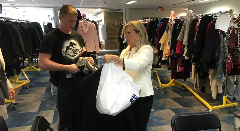 Danielle McNichol, director of Neumann University's center for leadership, helps outfit young people through the "Wardrobes for Work" program. Danielle McNichol, director of Neumann University's center for leadership, helps outfit young people through the "Wardrobes for Work" program.