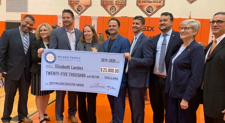 Marple Newtown High School science teacher Elizabeth Landes, fourth from the left, poses with school board members. Marple Newtown High School science teacher Elizabeth Landes, fourth from the left, poses with school board members.
