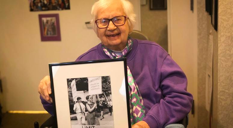 Kay Tobin-Lahusen holds a photograph she took of her partner and fellow activist Barbara Gittings. Kay Tobin-Lahusen holds a photograph she took of her partner and fellow activist Barbara Gittings.