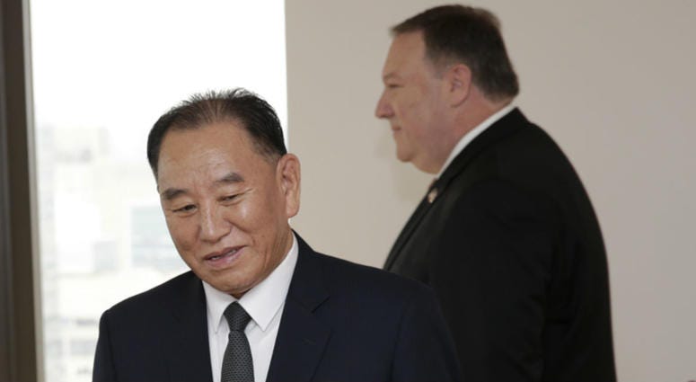 Kim Yong Chol, former North Korean military intelligence chief and one of Kim Jong Un's closest aides, left, and U.S. Secretary of State Mike Pompeo take their places at the table before a meeting, Thursday, May 31, 2018, in New York. Kim Yong Chol and Mike Pompeo