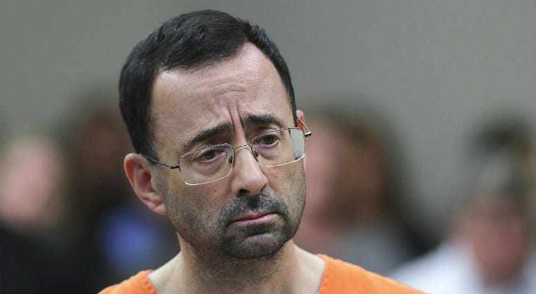 In this Nov. 22, 2017, file photo, Dr. Larry Nassar appears in court for a plea hearing in Lansing, Mich. Dr. Larry Nassar