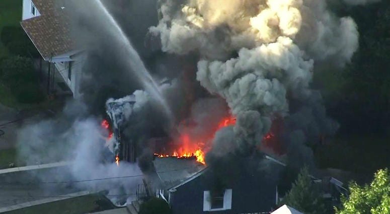 In this image take from video provided by WCVB in Boston, flames consume a home in Lawrence, Mass, a suburb of Boston, Thursday, Sept. 13, 2018. In this image take from video provided by WCVB in Boston, flames consume a home in Lawrence, Mass, a suburb of Boston, Thursday, Sept. 13, 2018.