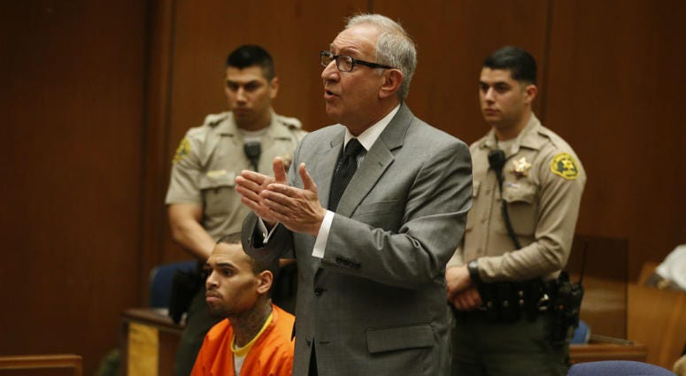 In this March 17, 2014, file photo, R&B singer Chris Brown, left, appears in Los Angeles Superior Court with his attorney Mark Geragos. In this March 17, 2014, file photo, R&B singer Chris Brown, left, appears in Los Angeles Superior Court with his attorney Mark Geragos.