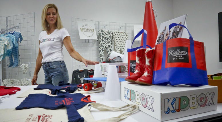 Kidbox CEO Miki Racine Berardelli, shows products for her online styling service for kids, in New York. Kidbox CEO Miki Racine Berardelli