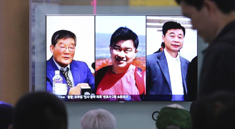 In this May 3, 2018 photo, people watch a TV news report on screen, showing portraits of three Americans, Kim Dong Chul, left, Tony Kim and Kim Hak Song, right, detained in the North Korea, at the Seoul Railway Station in Seoul, South Korea In this May 3, 2018 photo, people watch a TV news report on screen, showing portraits of three Americans, Kim Dong Chul, left, Tony Kim and Kim Hak Song, right, detained in the North Korea, at the Seoul Railway Station in Seoul, South Korea