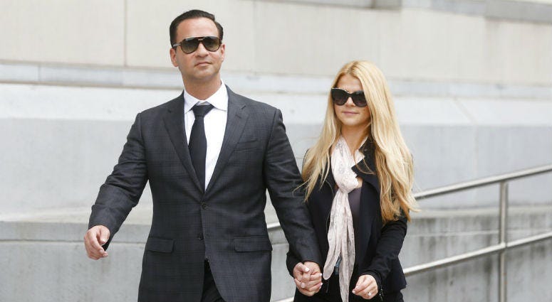 In this Oct. 5, 2018, file photo, Michael "The Situation" Sorrentino leaves federal court with his fiancee Lauren Pesce after his sentencing in Newark, N.J.