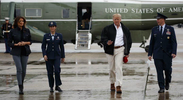 President Donald Trump and first lady Melania Trump board Air Force One for a trip to visit areas affected by Hurricane Michael, Monday, Oct. 15, 2018, in Andrews Air Force Base, Md. President Donald Trump and first lady Melania Trump board Air Force One for a trip to visit areas affected by Hurricane Michael, Monday, Oct. 15, 2018, in Andrews Air Force Base, Md.