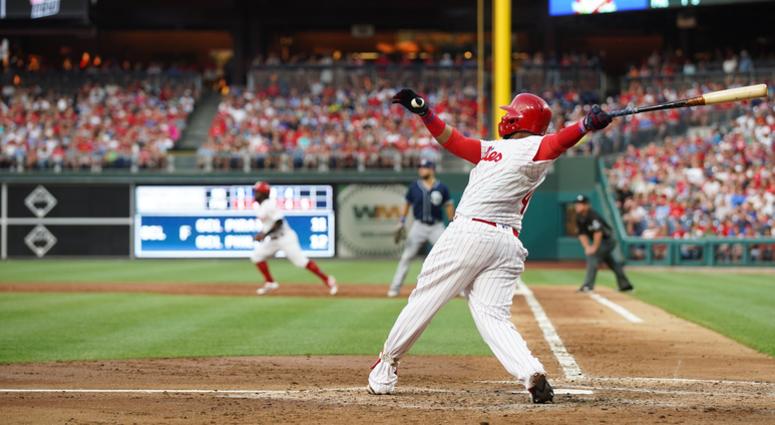 Phillies first baseman Carlos Santana (41) hits a three RBI home run during the second inning against the San Diego Padres at Citizens Bank Park. carlos santana