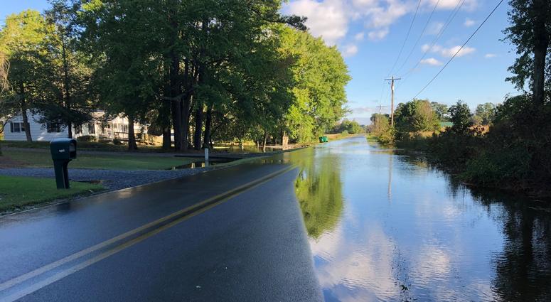 Ditches overflow across Nutters Cross Road between Johnson and Snow Hill roads in Salisbury, Maryland, due to remnants of Tropical Storm Michael on Oct. 12, 2018. Ditches overflow due to remnants of Tropical Storm Michael.
