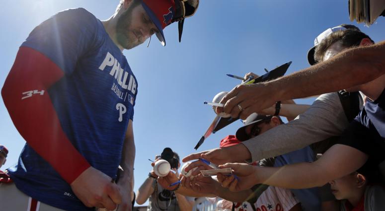 Philadelphia Phillies right fielder Bryce Harper (3) signs autographs for fans after he works out at Spectrum Field, March 3, 2019. Philadelphia Phillies right fielder Bryce Harper