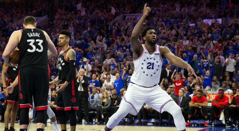 May 2, 2019; Philadelphia, PA, USA; Philadelphia 76ers center Joel Embiid (21) reacts in front of Toronto Raptors center Marc Gasol (33) and guard Danny Green (14) after a score in game three of the second round of the 2019 NBA Playoffs at Wells Fargo Cen May 2, 2019; Philadelphia, PA, USA; Philadelphia 76ers center Joel Embiid (21) reacts in front of Toronto Raptors center Marc Gasol (33) and guard Danny Green (14) after a score in game three of the second round of the 2019 NBA Playoffs at Wells Fargo Cen