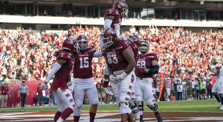 Sep 28, 2019; Philadelphia, PA, USA; Temple Owls offensive lineman Vincent Picozzi (76) lifts up Temple Owls running back Re'Mahn Davis (20) to celebrate his touchdown. Sep 28, 2019; Philadelphia, PA, USA; Temple Owls offensive lineman Vincent Picozzi (76) lifts up Temple Owls running back Re'Mahn Davis (20) to celebrate his touchdown.