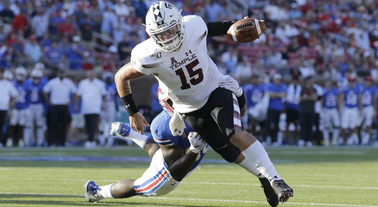 Oct 19, 2019; Dallas, TX, USA; Temple Owls quarterback Anthony Russo (15) scores a touchdown in the fourth quarter against the Southern Methodist Mustangs at Gerald J. Ford Stadium. Temple Owls quarterback Anthony Russo (15) scores a touchdown in the fourth quarter against the Southern Methodist Mustangs at Gerald J. Ford Stadium.