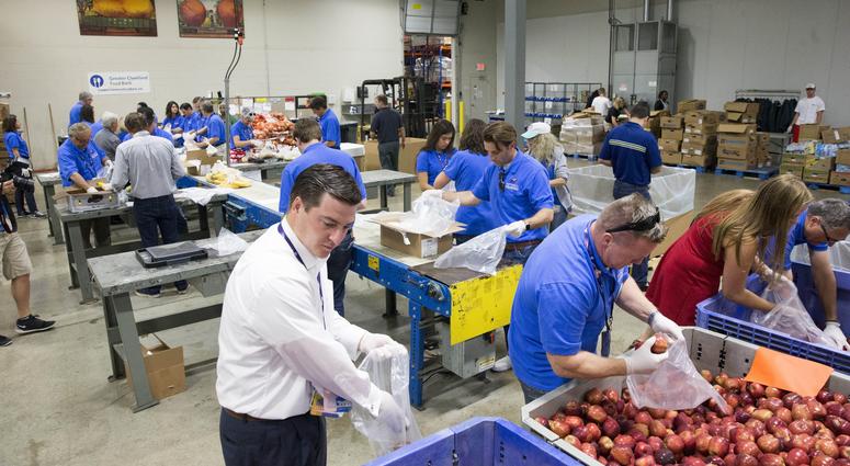 Jul 21, 2016; Cleveland, OH, USA; Arizona delegates help out to pack food bags at Greater Cleveland Food Bank as a part of Arizona delegation community project during the Republican National Convention. Jul 21, 2016; Cleveland, OH, USA; Arizona delegates help out to pack food bags at Greater Cleveland Food Bank as a part of Arizona delegation community project during the Republican National Convention.