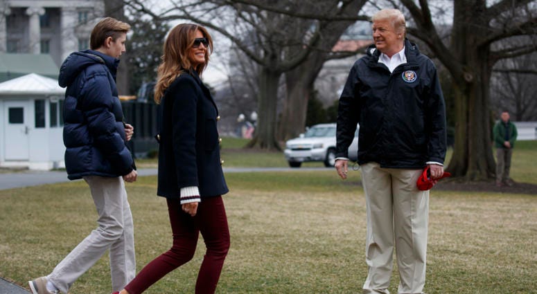 In this March 8, 2019 file photo, President Donald Trump waits for his son Barron Trump, and first lady Melania Trump after speaking with reporters before traveling to Alabama to visit areas affected by the deadly tornadoes. In this March 8, 2019 file photo, President Donald Trump waits for his son Barron Trump, and first lady Melania Trump after speaking with reporters before traveling to Alabama to visit areas affected by the deadly tornadoes.