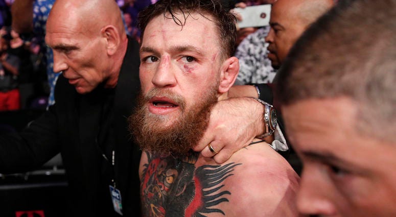 In this Oct. 6, 2018, file photo, Conor McGregor walks out of the arena after he was defeated by Khabib Nurmagomedov in a lightweight title mixed martial arts bout at UFC 229 in Las Vegas. In this Oct. 6, 2018, file photo, Conor McGregor walks out of the arena after he was defeated by Khabib Nurmagomedov in a lightweight title mixed martial arts bout at UFC 229 in Las Vegas.