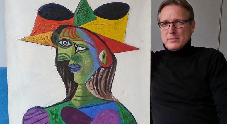This image released on Tuesday March 26, 2019 by Arthur Brand, shows Dutch art detective Arthur Brand with "Buste de Femme", a recovered Picasso painting. The painting was stolen from a wealthy Saudi's yacht 20 years ago. This image released on Tuesday March 26, 2019 by Arthur Brand, shows Dutch art detective Arthur Brand with "Buste de Femme", a recovered Picasso painting. The painting was stolen from a wealthy Saudi's yacht 20 years ago.