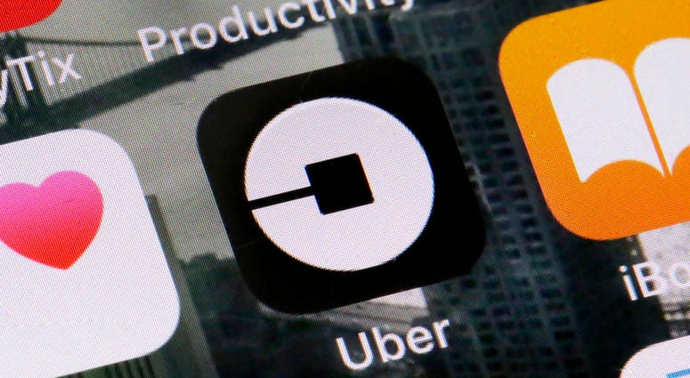 This June 12, 2018, file photo shows the Uber app on a phone in New York. This June 12, 2018, file photo shows the Uber app on a phone in New York.
