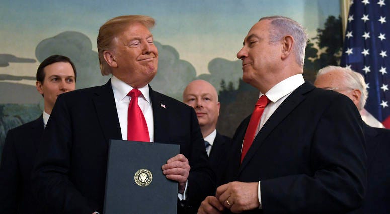 FILE - In this Monday, March 25, 2019 file photo, President Donald Trump smiles at Israeli Prime Minister Benjamin Netanyahu, right, after signing a proclamation in the Diplomatic Reception Room at the White House in Washington. Trump isn't on the ballot FILE - In this Monday, March 25, 2019 file photo, President Donald Trump smiles at Israeli Prime Minister Benjamin Netanyahu, right, after signing a proclamation in the Diplomatic Reception Room at the White House in Washington. Trump isn't on the ballot