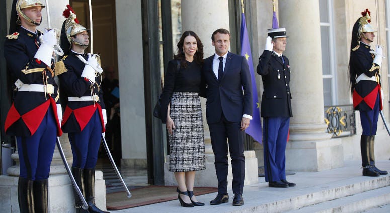 New Zealand Prime Minister Jacinda Ardern, center left, is greeted by French President Emmanuel Macron, center right, as she arrives at the Elysee Palace, in Paris, Wednesday, May 15, 2019. New Zealand Prime Minister Jacinda Ardern, center left, is greeted by French President Emmanuel Macron, center right, as she arrives at the Elysee Palace, in Paris, Wednesday, May 15, 2019.