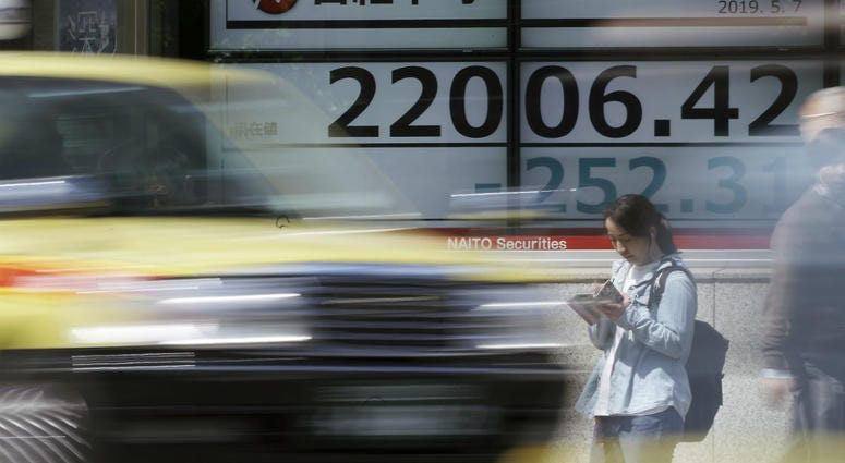 An electronic stock board shows Japan's Nikkei 225 index at a securities firm in Tokyo Tuesday, May 7, 2019. An electronic stock board shows Japan's Nikkei 225 index at a securities firm in Tokyo Tuesday, May 7, 2019.
