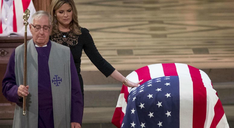 Jenna Bush Hager, the daughter of former President George Bush, touches the casket of former President George H.W. Bush after speaking at his State Funeral at the National Cathedral, December 5, 2018 in Washington, DC. Jenna Bush Hager, the daughter of former President George Bush, touches the casket of former President George H.W. Bush after speaking at his State Funeral at the National Cathedral, December 5, 2018 in Washington, DC.