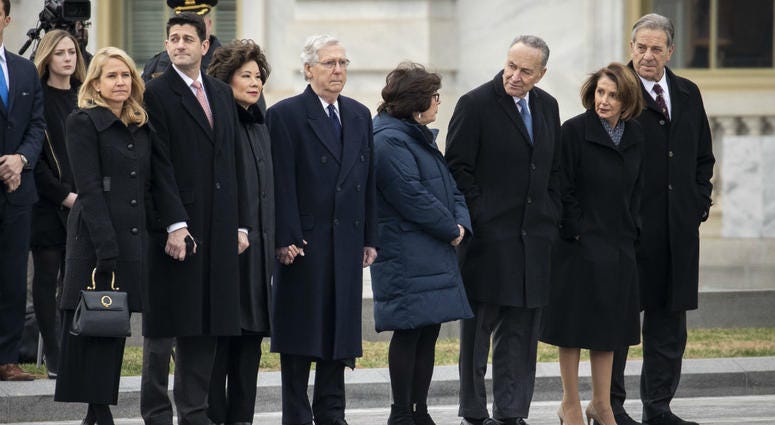 Janna Ryan, Paul Ryan, Elaine Chao, Mitch McConnell, Iris Weinshall, Chuck Schumer, Nancy Pelosi and Paul Pelosi await the departure of the flag-draped casket of the late former President George H.W. Bush at the U.S. Capitol, December 5, 2018. Janna Ryan, Paul Ryan, Elaine Chao, Mitch McConnell, Iris Weinshall, Chuck Schumer, Nancy Pelosi and Paul Pelosi await the departure of the flag-draped casket of the late former President George H.W. Bush at the U.S. Capitol, December 5, 2018.