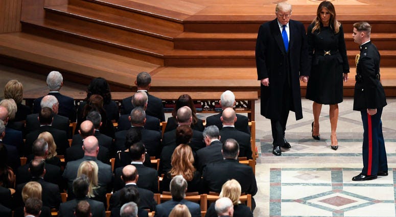 President Donald Trump and first lady Melanie Trump arrive as former President George H.W. Bush is honored with a state funeral at the Washington National Cathedral. President Donald Trump and first lady Melanie Trump arrive as former President George H.W. Bush is honored with a state funeral at the Washington National Cathedral.